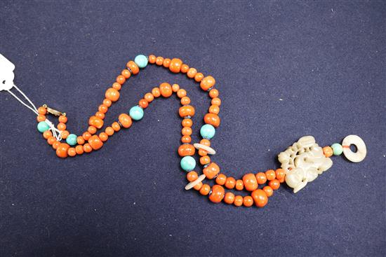 A carved jade, coral and hardstone bead necklace with silver gilt clasp, 32in.